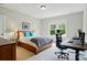 Comfortable bedroom featuring a well-made bed, cozy decor, and a bright window, offering a serene space at 15714 Laurel Oak Cres, Davidson, NC 28036