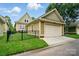 Home exterior with garage and fenced yard offering outdoor enjoyment at 15714 Laurel Oak Cres, Davidson, NC 28036