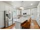 Bright kitchen features granite countertops, stainless steel appliances, and a stylish central island at 15714 Laurel Oak Cres, Davidson, NC 28036