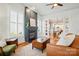 Inviting living room featuring a fireplace, hardwood floors, and an open layout leading to dining at 15714 Laurel Oak Cres, Davidson, NC 28036