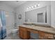 Bathroom with a vanity, granite countertop, and shower-tub combination at 15831 Breton Brook St, Huntersville, NC 28078