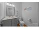 Charming powder room with marble countertop and modern fixtures at 15831 Breton Brook St, Huntersville, NC 28078