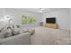 Cozy bonus room with plush seating and a large window at 15831 Breton Brook St, Huntersville, NC 28078