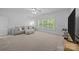 Large bonus room with plush seating and lots of light at 15831 Breton Brook St, Huntersville, NC 28078