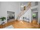 Grand foyer with hardwood floors, a staircase, and access to living and dining areas at 15831 Breton Brook St, Huntersville, NC 28078
