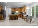 Well-lit kitchen with island, breakfast bar and stainless steel appliances at 15831 Breton Brook St, Huntersville, NC 28078