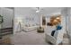 Open-concept living room flowing into a kitchen, featuring plush seating and stylish decor at 15831 Breton Brook St, Huntersville, NC 28078