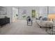 Bright and airy living room with a large window, plush seating, and modern decor at 15831 Breton Brook St, Huntersville, NC 28078
