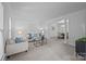 Spacious living room with open access to the dining area, featuring stylish decor and plush seating at 15831 Breton Brook St, Huntersville, NC 28078