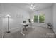 Bright office space featuring a modern desk, comfortable chair, and ample natural light from the window at 15831 Breton Brook St, Huntersville, NC 28078