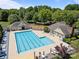 Resort-style pool with lounge chairs and umbrellas for relaxing on the sun-soaked pool deck at 15831 Breton Brook St, Huntersville, NC 28078