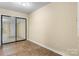Neutral bedroom with tile floor and sliding mirror closet at 160 17Th Street Nw Pl, Hickory, NC 28601