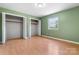This cozy bedroom features wood floors, two closets and a window overlooking the yard at 160 17Th Street Nw Pl, Hickory, NC 28601