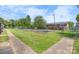 Exterior view of the community's recreational area with grassy area and fence at 160 17Th Street Nw Pl, Hickory, NC 28601