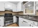 Kitchen with stainless steel oven, tile flooring, and white cabinets at 160 17Th Street Nw Pl, Hickory, NC 28601