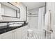 Bathroom featuring black and white tile and a shower and tub combo at 18028 Broken Woods Rd, Charlotte, NC 28278