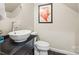 Stylish half bath with a modern vessel sink and unique faucet at 18028 Broken Woods Rd, Charlotte, NC 28278