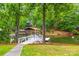 A dock on the lake with a covered boat lift at 18028 Broken Woods Rd, Charlotte, NC 28278