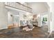 Bright foyer features soaring ceilings, stone floors, and a decorative mirror creating a welcoming entrance at 18028 Broken Woods Rd, Charlotte, NC 28278