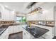 Well-appointed kitchen with granite countertops, white cabinets, and a view of the lake at 18028 Broken Woods Rd, Charlotte, NC 28278