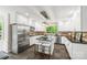 This kitchen boasts stainless steel appliances, a granite island and a view of the outdoors at 18028 Broken Woods Rd, Charlotte, NC 28278
