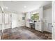 Bright laundry room offers white cabinetry, counter space, and natural light at 18028 Broken Woods Rd, Charlotte, NC 28278