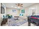 Bright living room featuring a sectional, a game table, and attractive decor at 18028 Broken Woods Rd, Charlotte, NC 28278