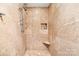 Tiled shower with a rainfall showerhead and a built-in niche at 18028 Broken Woods Rd, Charlotte, NC 28278