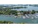 Panoramic aerial view of a bustling marina and waterfront homes nestled along the shoreline at 18705 Harbor Light Blvd, Cornelius, NC 28031