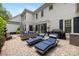 Well-appointed patio with lounge chairs, outdoor furniture, grill, and water feature, perfect for relaxation and entertaining at 18705 Harbor Light Blvd, Cornelius, NC 28031