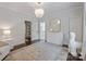 Cozy bedroom with elegant chandelier, hardwood floors and plenty of natural light at 18705 Harbor Light Blvd, Cornelius, NC 28031