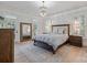 Spacious main bedroom features a chandelier, hardwood floors, and natural light at 18705 Harbor Light Blvd, Cornelius, NC 28031