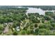 Lush, green aerial view of a lakeside community with pools and beautiful mature tree coverage at 188 Turnberry Ln, Mooresville, NC 28117