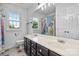 Bright bathroom showcasing double sinks with ample cabinet space, and a unique Star Wars shower curtain at 188 Turnberry Ln, Mooresville, NC 28117
