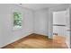 Empty bedroom with hardwood floors and a window offering natural light at 188 Turnberry Ln, Mooresville, NC 28117