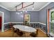 Charming dining room with modern lighting and a white oval table at 188 Turnberry Ln, Mooresville, NC 28117
