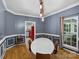 Bright dining room with paneled walls and a large oval table at 188 Turnberry Ln, Mooresville, NC 28117