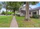 Two-story home with mature landscaping and a sidewalk that leads to the front door at 188 Turnberry Ln, Mooresville, NC 28117
