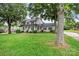 Inviting two-story home with a charming front porch, shutters and mature trees at 188 Turnberry Ln, Mooresville, NC 28117
