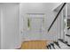 Bright and airy foyer with hardwood floors, a staircase, and a transom window above the front door at 188 Turnberry Ln, Mooresville, NC 28117