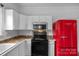 Modern kitchen with white cabinets and stainless steel appliances at 188 Turnberry Ln, Mooresville, NC 28117