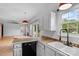 Kitchen area with backyard views and access to a deck, perfect for outdoor entertaining at 188 Turnberry Ln, Mooresville, NC 28117