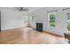 Bright living room features hardwood floors and a fireplace, perfect for relaxing at 188 Turnberry Ln, Mooresville, NC 28117