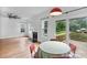 Open floor plan featuring a fireplace, backyard views, and access to a deck at 188 Turnberry Ln, Mooresville, NC 28117
