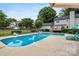 The backyard features a beautiful pool, lounge chairs, and manicured landscaping at 188 Turnberry Ln, Mooresville, NC 28117