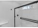 Modern glass shower, sleek fixtures, white tiling, and black hardware at 188 Turnberry Ln, Mooresville, NC 28117