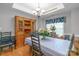 Charming dining room features a tray ceiling, a large hutch, and a table with seating for six at 2020 Olde Towne Dr, Monroe, NC 28110
