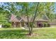 Charming home exterior with a welcoming porch and landscaped front yard at 2020 Olde Towne Dr, Monroe, NC 28110