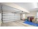 Clean garage featuring a large garage door, ample space, and overhead lighting at 2020 Olde Towne Dr, Monroe, NC 28110