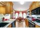 Bright kitchen offering warm wood cabinetry, modern appliances, and a charming breakfast nook at 2020 Olde Towne Dr, Monroe, NC 28110